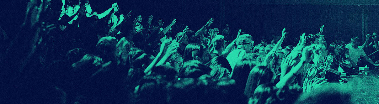 Audience with many hands in the air