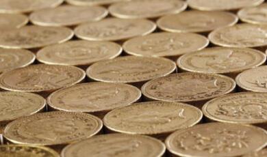 A close-up of golden pound coins