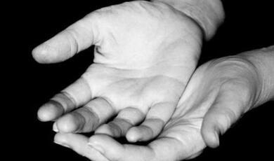 black and white hands open in receiving gesture