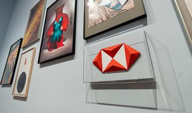Art on a gallery wall with HSBC logo next to it