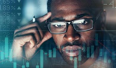 an image of a man looking intently at a screen