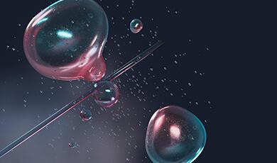 Abstract image featuring translucent, glowing bubbles in shades of pink and blue, suspended around a thin diagonal line against a dark background