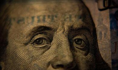 Close up of Benjamin Franklin on the $100 bill