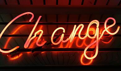 Neon sign reading 'Change'