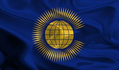 Commonwealth flag, golden globe with spiked surround on blue background