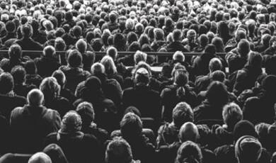 Black and white photo of crowd of people
