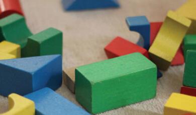 An image of colourful toy building blocks