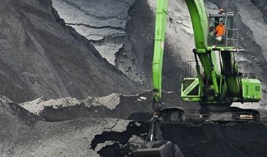 Mechanical digger in quarry