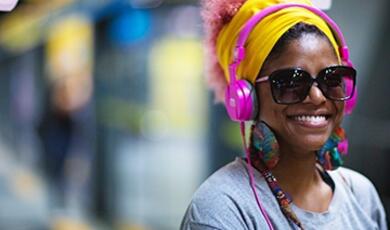 smiling woman in headphones