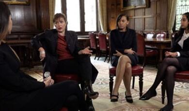 Professor Jo Delahunty sitting with other women