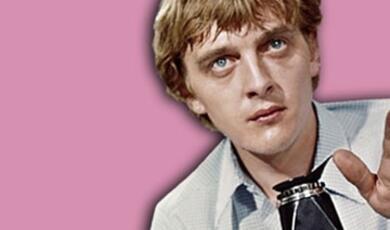 David Hemmings, an English actor, holding a Hasselblad 500cm camera