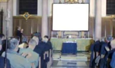 audience and projection screen in a church