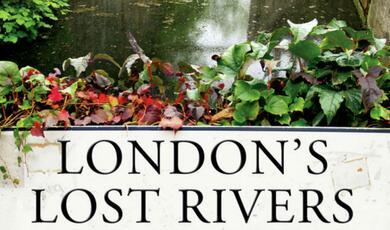 Sign by riverbank with London's Lost Rivers written on it
