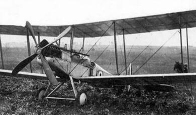 Black and white photograph of early bi-plane