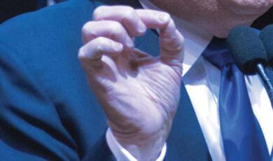 Close-up of man's hand, pressing his index finger and thumb together