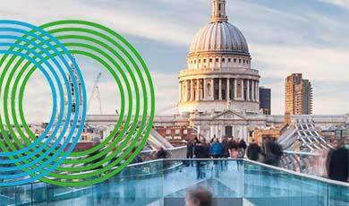 the millennium bridge with st pauls in the background, with a dual concentric circle logo on the left