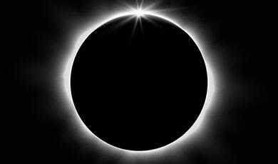 total eclipse; thin circlet of light