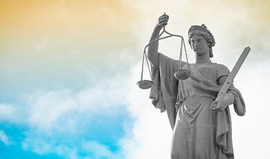 Statue of Lady Justice holding scales and sword