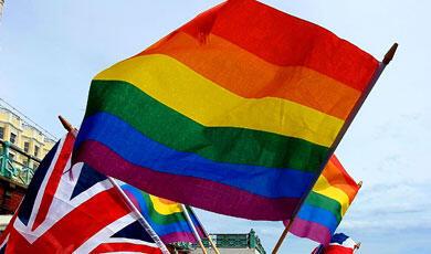 A photograph of the LBGTQ+ flag and the Union Jack