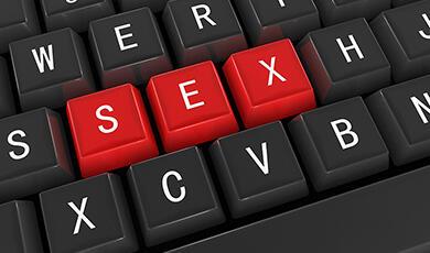 the word 'sex' highlighted in red on a keyboard
