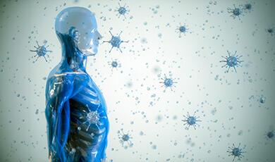 Human body side on, surrounded by glowing blue pathongens