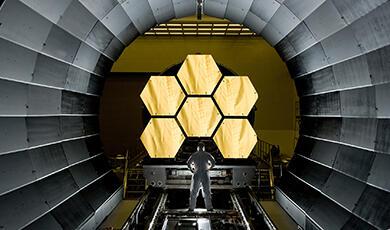 a man looking at the JWST