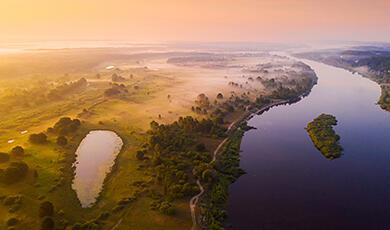 an arial photograph of a river and countryside landscape