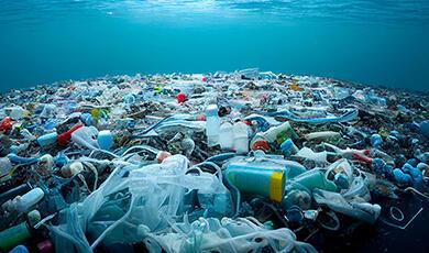 Underwater view of a vast accumulation of plastic pollution in the ocean