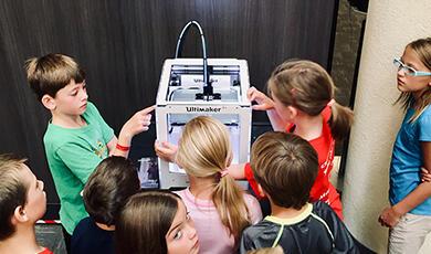 Children using scientific machine
