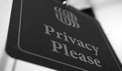 sign on hotel door saying Privacy Please