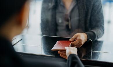 lady handing over passport