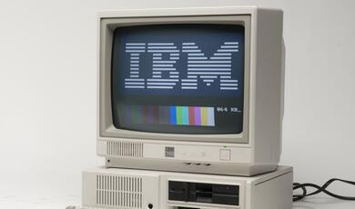 old computer with IBM logo on screen