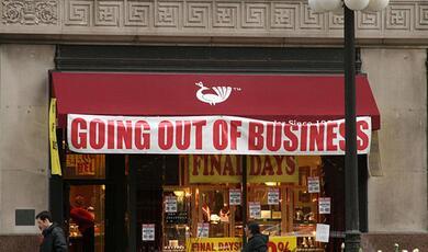 Shope with 'Going Out of Business' banner on it